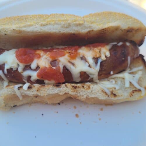Sausage on a Bun with tomato and cheese