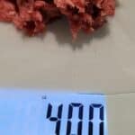 four ounces of ground beef of a food scale
