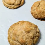 Soft Cinnamon Cookies on parchment paper lined cookie sheet.